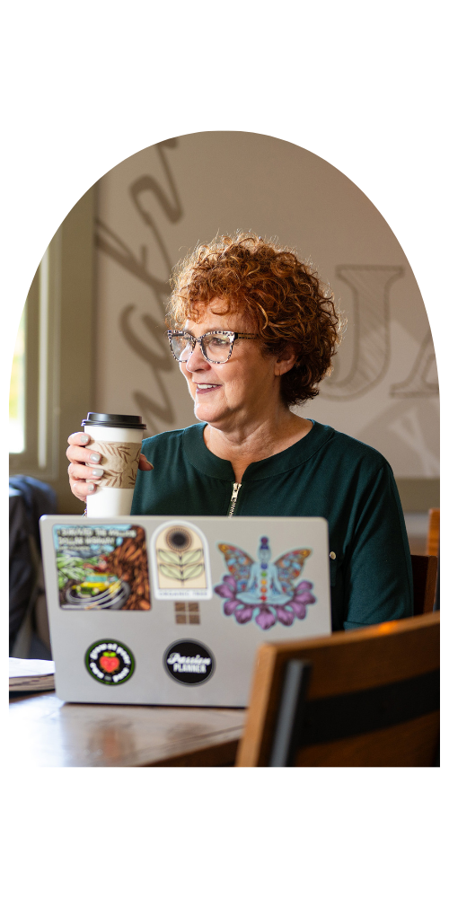 a photo of Allison Field holding a cup of coffee during a coaching seassion